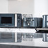 Black and silver Salter microwave oven on marble worktop