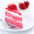 Slice of strawberry cake with cream filling, strawberry glaze, and fresh strawberry on top.