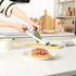 Salter manual food chopper and slicer set with clear containers, on kitchen counter