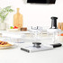Set of Salter manual food choppers and graters in white and black on a kitchen counter