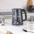 Black marble-effect electric kettle, shown from the back on white background