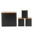 Set of four black storage canisters with bamboo lids, ideal for kitchen organisation.