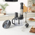 Black and silver food processor with accessories on kitchen countertop