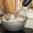 Black and silver food processor with accessories on kitchen countertop