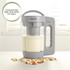 Salter nut milk maker with fresh milk and mixed nuts on worktop