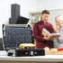 Electric panini press with sandwich on grill in modern kitchen setting