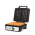 Black waffle maker with two golden waffles, lid open, showing temperature dial