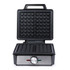 Black electric waffle maker with open lid, metal dial and light indicator, shown front-on.