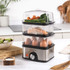 Salter compact 3-tier food steamer with eggs, salmon and vegetables shown in each layer
