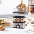 Salter stainless steel sous vide cooker with dial, shown with eggs, salmon and salad.