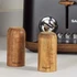 Set of two Salter wooden salt and pepper shakers beside matt black toaster