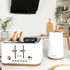 White four-slice toaster with wood accents, shown from the front with crumb trays extended