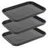 Set of three black rectangular serving trays, shown stacked, with a speckled finish
