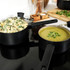 Non-stick brown saucepan with black handle, shown from above.