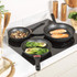 Set of three black non-stick frying pans with speckled finish and handles