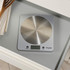 Slim silver digital kitchen scale showing size: 18cm x 16cm x 2cm