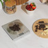 Digital kitchen scale weighing dark chocolate pieces on countertop