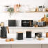 Black four-slice toaster with wood accents, showing toasted bread in a modern UK kitchen