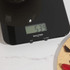 Black Salter digital kitchen scale weighing bowl, display shows 539 grams
