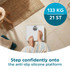 Mechanical bathroom scale in white, shown in use on tiled floor.