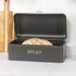 Matte black electric kettle and matching tea caddy with rose gold accents on kitchen worktop