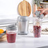 Salter grey smoothie blender in use with fruit and two blending cups on kitchen worktop