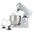 Silver stand mixer with large bowl and three attachments: whisk, dough hook, beater.