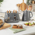 Grey ribbed electric kettle with loop handle, shown on white background