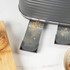 Grey four-slice toaster with ribbed sides and metal crumb trays, angled product image