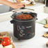 Black Salter slow cooker with glass lid, front controls and side handles on white background