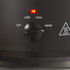 Black slow cooker control dial showing settings for off, low, high and warm