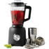 Black blender with red drink and ice, cocktail shaker set and lime wedges beside