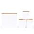 Set of four white kitchen storage canisters with bamboo lids, shown in different sizes.