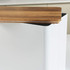 White square bread bin with bamboo lid on kitchen countertop