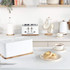 White Salter toaster, kettle, bread bin and mugs on kitchen worktop, with crumpets and tea