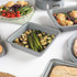 Square grey baking tin with roasted vegetables on kitchen counter