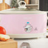 Pink Salter slow cooker with dial control shown on kitchen worktop