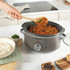 Salter slow cooker control dial showing heat settings and red indicator light