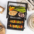Black electric contact grill open, showing ridged plates, for sandwiches or paninis