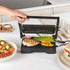 Black electric grill open flat, showing non-stick ridged plates with power indicator