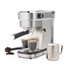 Stainless steel espresso machine with two espresso cups, milk jug, and coffee scoop