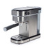 Stainless steel espresso machine with two espresso cups, milk jug, and coffee scoop