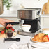 Black and silver espresso coffee machine with steam wand, shown at angle
