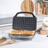Salter silver sandwich toaster closed, showing indicator lights and handle
