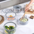 Salter stackable food steamer set on kitchen counter with rice, vegetables, and salmon.
