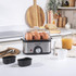 Silver electric egg cooker with accessories, shown disassembled on white background