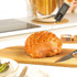 Black digital cooking thermometer with metal probe, shown side view
