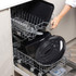 Large black roasting pan and lid loaded in dishwasher rack
