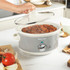 Grey Salter slow cooker with stew being served in modern kitchen setting