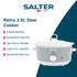 Grey Salter slow cooker with white handles and dial, shown empty from above